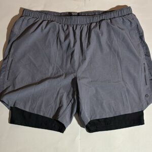 Gray AB3 running shorts with black compression liner. Ideal for workouts and athletic activities.