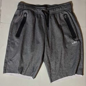 Gray CSG shorts with black zipper pockets and drawstring. Perfect for casual wear or workouts.