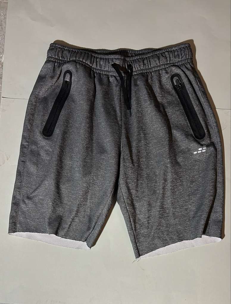 Gray AB3 running shorts with black compression liner. Ideal for workouts and athletic activities.